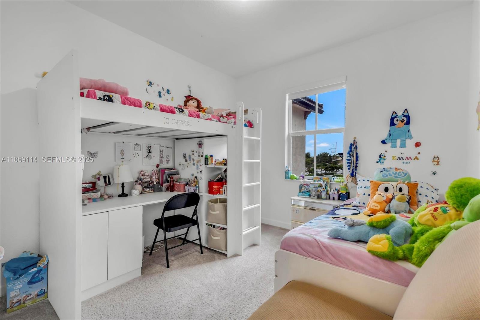 12774 Northwest 22nd Place Miami, FL 33167 - Photo 11 of 32 a bedroom with baby toys and a baby crib