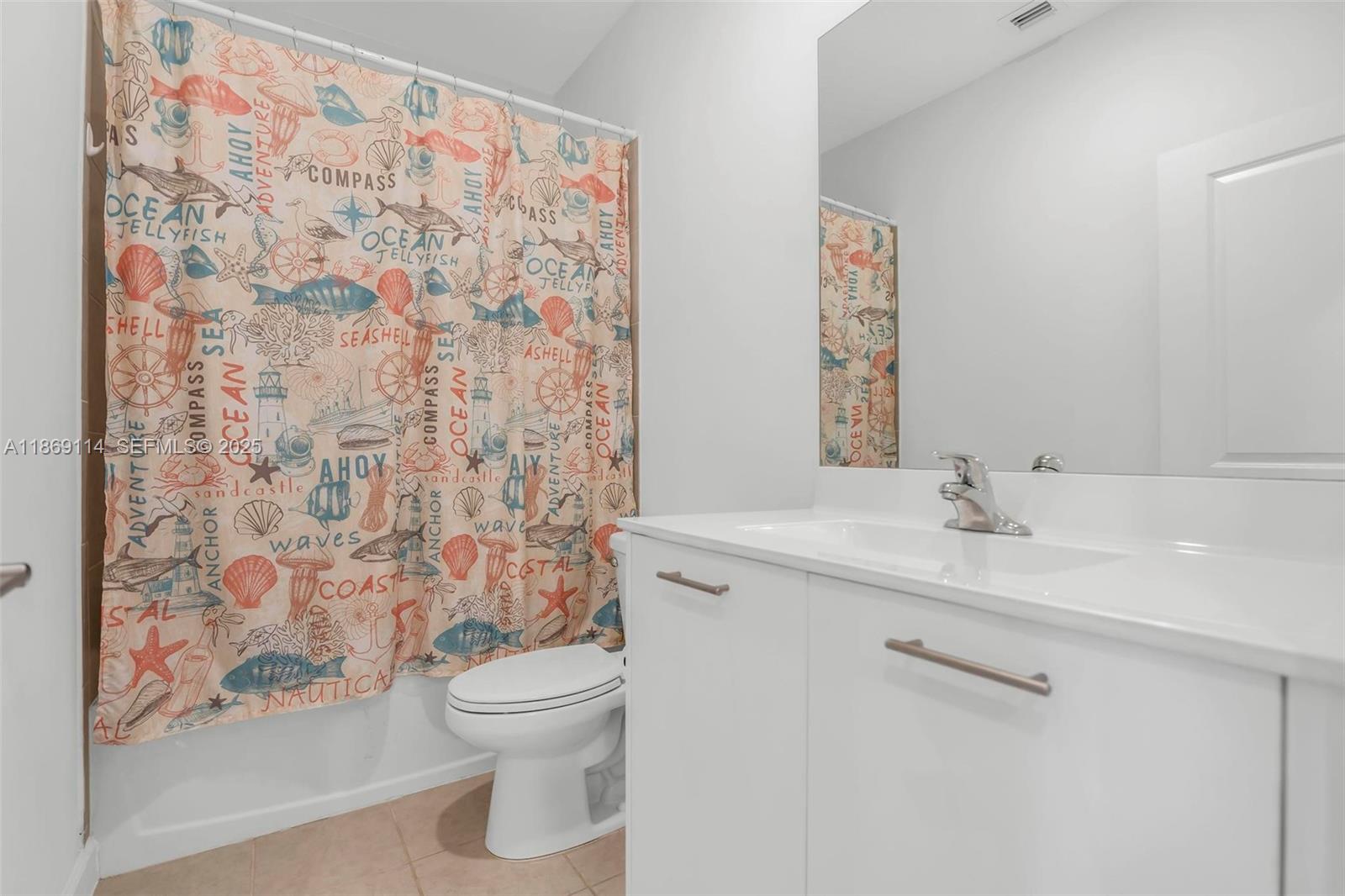 12774 Northwest 22nd Place Miami, FL 33167 - Photo 13 of 32 a bathroom with a granite countertop sink a toilet and a shower