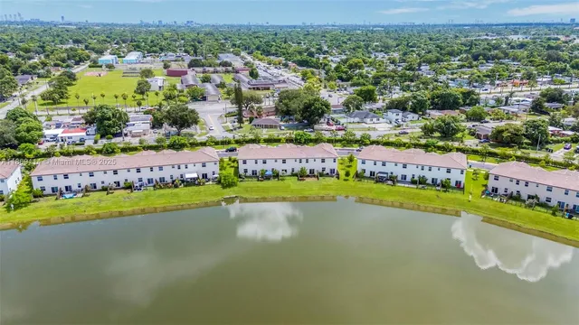 an aerial view of residential house with outdoor space and swimming pool