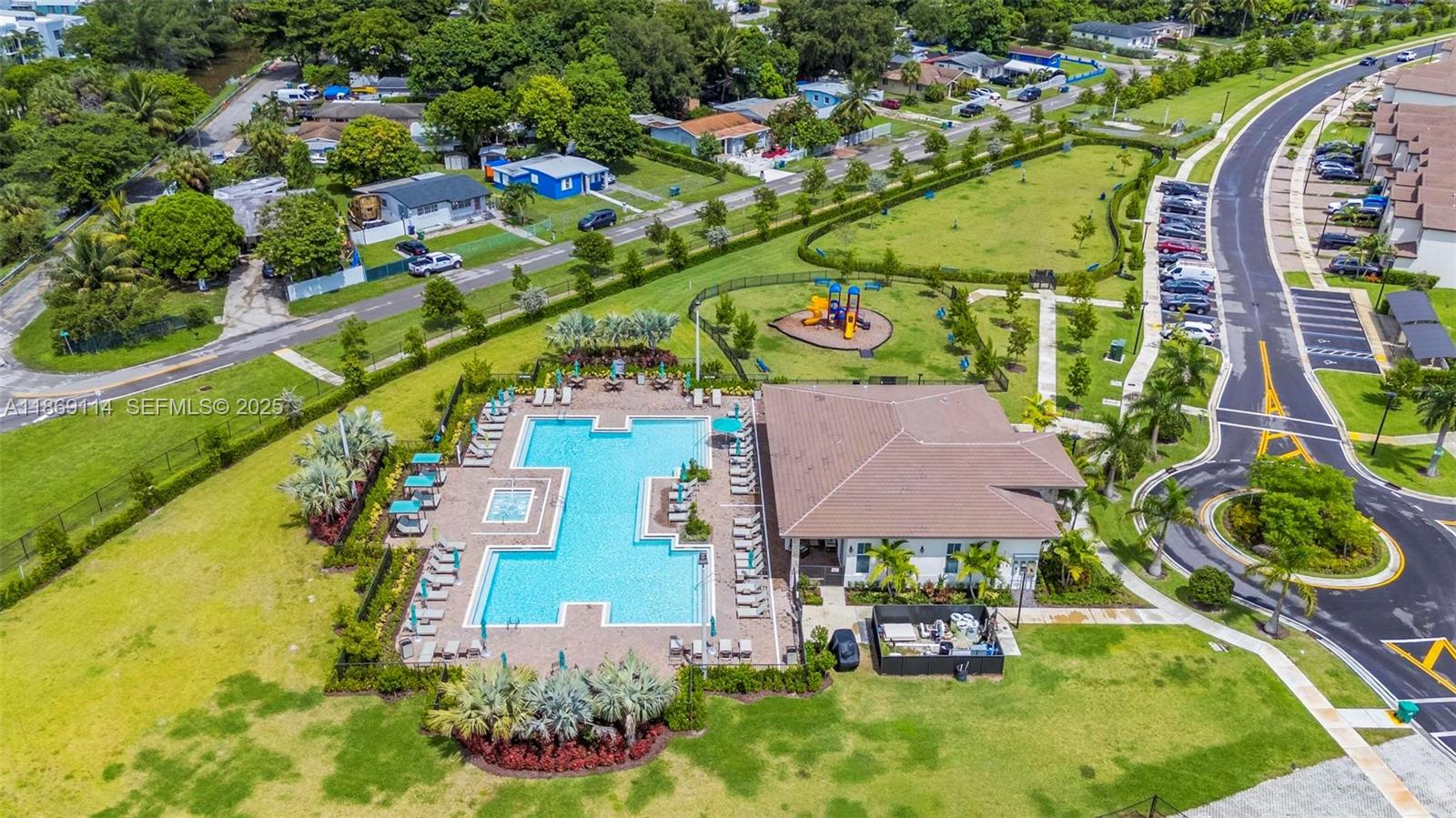 12774 Northwest 22nd Place Miami, FL 33167 - Photo 27 of 32 an aerial view of a house with a garden and lake view
