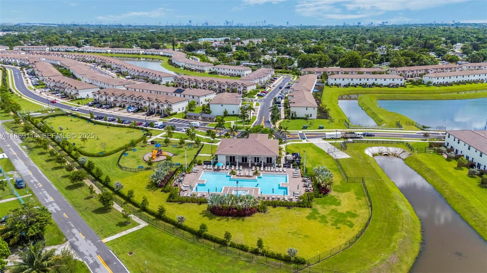12774 Northwest 22nd Place Miami, FL 33167 - Photo 29 of 32 an aerial view of residential houses with outdoor space and swimming pool