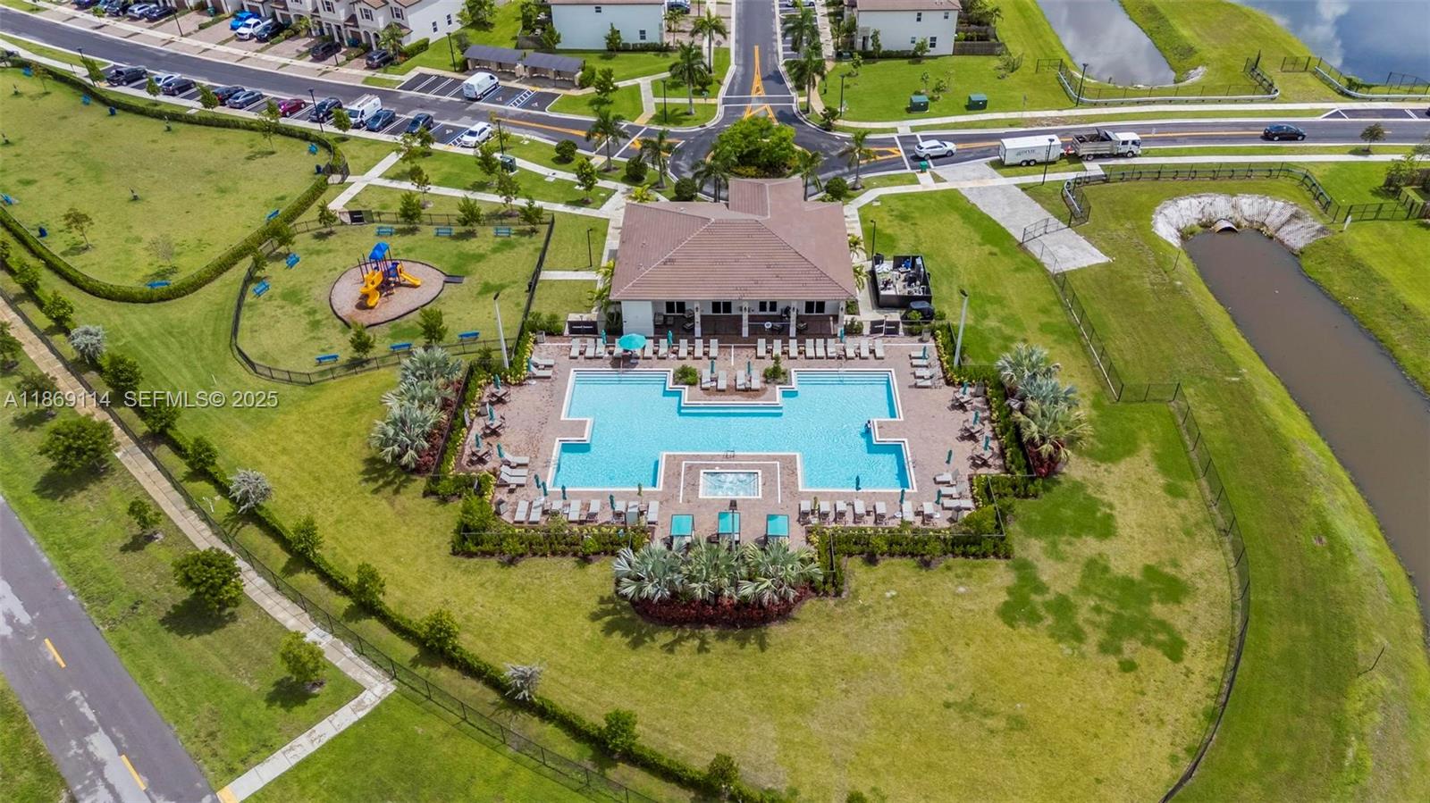 12774 Northwest 22nd Place Miami, FL 33167 - Photo 30 of 32 an aerial view of a house with a garden and swimming pool