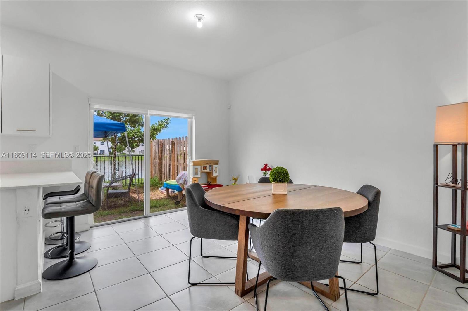12774 Northwest 22nd Place Miami, FL 33167 - Photo 5 of 32 a view of a dining room with furniture