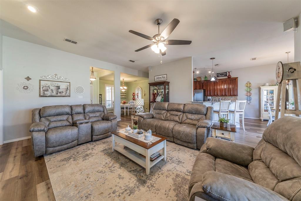11621 Willow Springs Road Fort Worth, TX 76052 - Photo 2 of 35 a living room with furniture and a ceiling fan