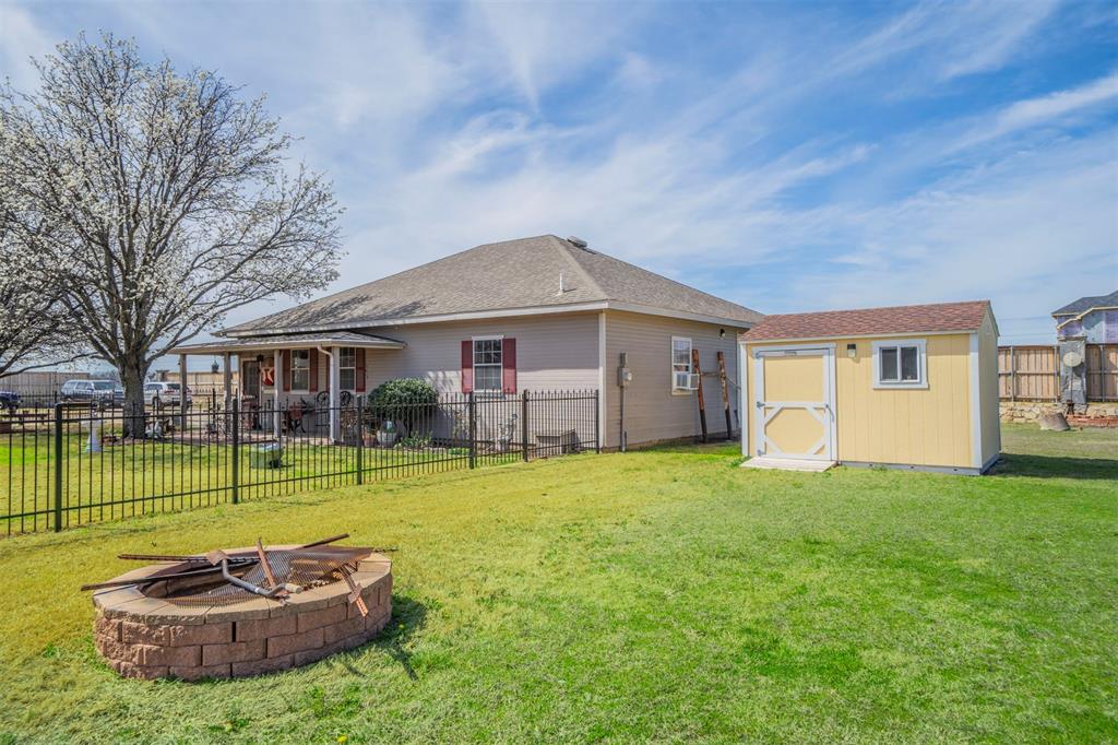 11621 Willow Springs Road Fort Worth, TX 76052 - Photo 23 of 35 a front view of a house with garden