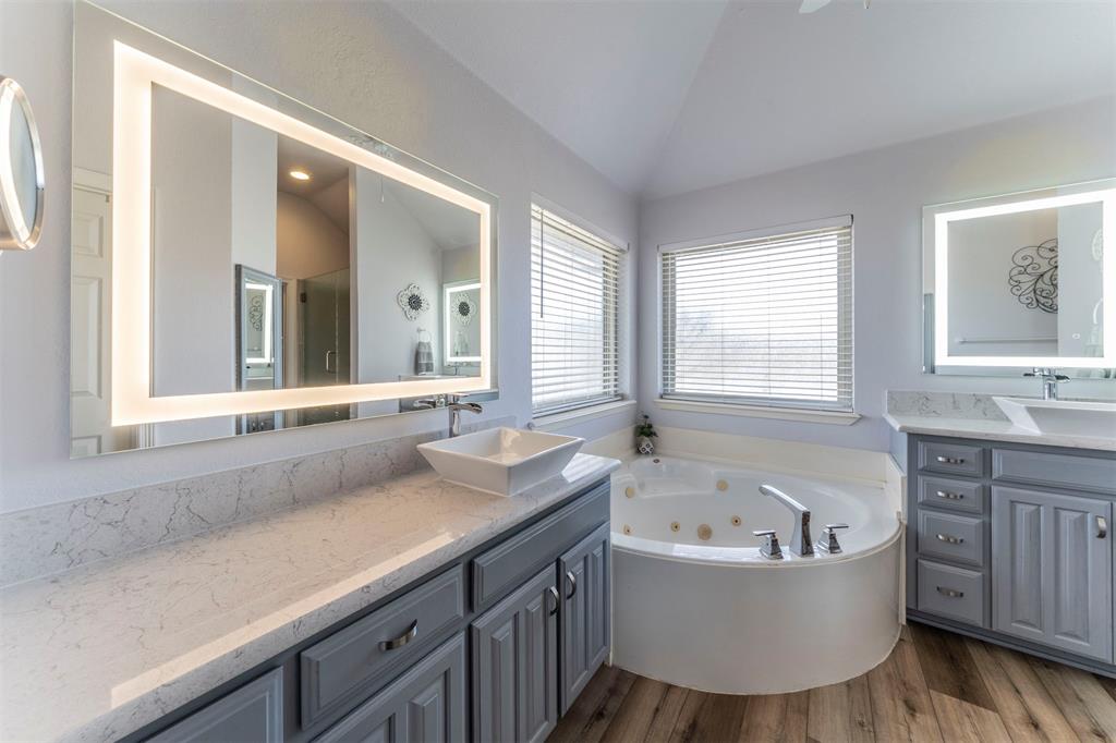 11621 Willow Springs Road Fort Worth, TX 76052 - Photo 9 of 35 a bathroom with a granite countertop tub sink and mirror