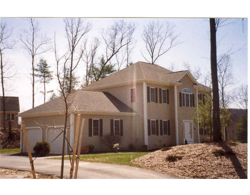 20 Tannery Road Sturbridge, MA 01518 - Photo 4 of 15 a front view of a house with a yard