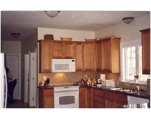 20 Tannery Road Sturbridge, MA 01518 - Photo 8 of 15 a kitchen with a sink cabinets and window