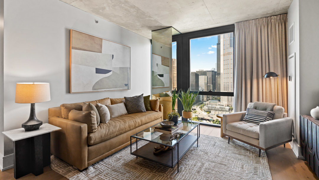 234 West Polk Street, Unit 2708 Chicago, IL 60607 - Photo 2 of 16 a living room with furniture and a large window