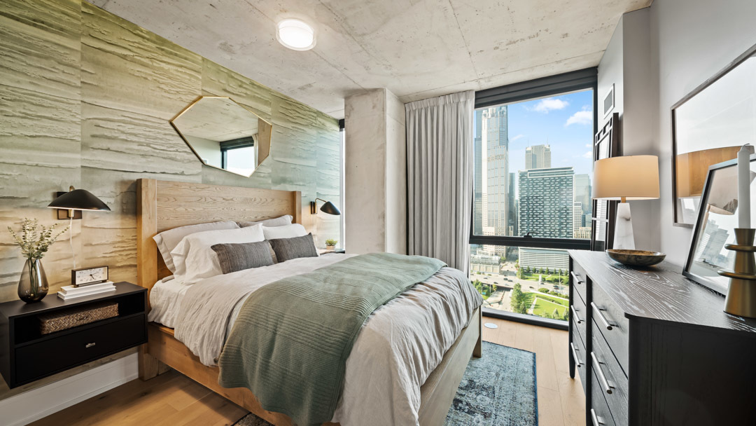 234 West Polk Street, Unit 2708 Chicago, IL 60607 - Photo 4 of 16 a bedroom with a bed a dresser next to a window