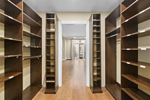 a view of closet area with rug