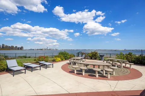 a view of a swimming pool with lounge chair