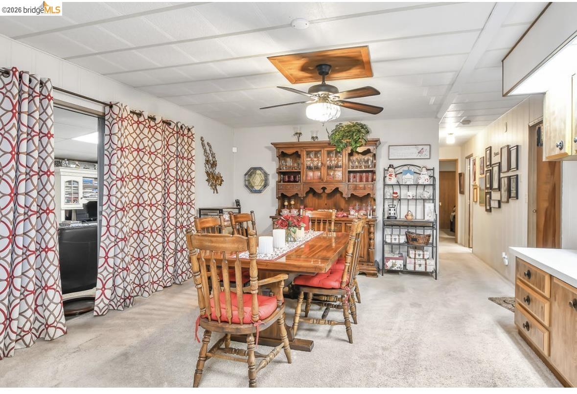 4603 Balfour Road, Unit 86 Brentwood, CA 94513 - Photo 11 of 24 Dining space with light colored carpet and ceiling fan