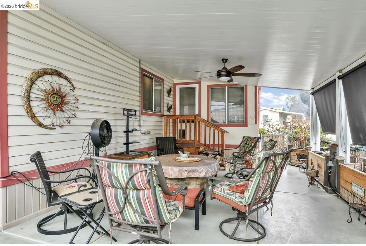 4603 Balfour Road, Unit 86 Brentwood, CA 94513 - Photo 19 of 24 View of patio / terrace featuring ceiling fan, outdoor dining area, and a sunroom