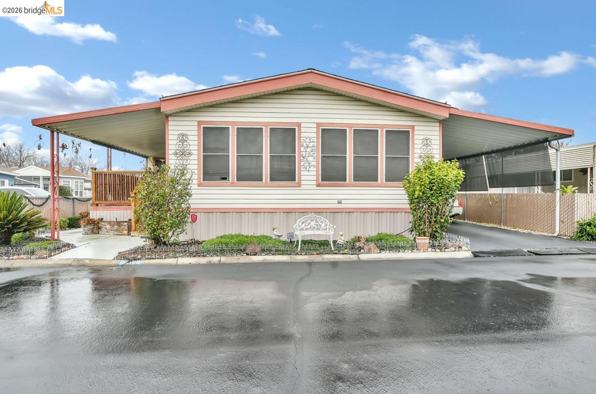 4603 Balfour Road, Unit 86 Brentwood, CA 94513 - Photo 2 of 24 View of home's exterior featuring an attached carport