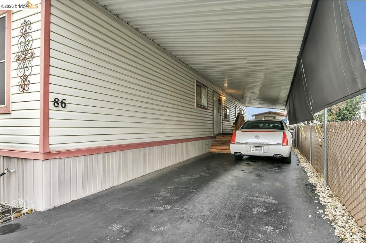 4603 Balfour Road, Unit 86 Brentwood, CA 94513 - Photo 21 of 24 View of vehicle parking with an attached carport