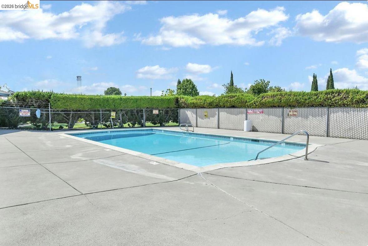 4603 Balfour Road, Unit 86 Brentwood, CA 94513 - Photo 23 of 24 Community pool with a patio area