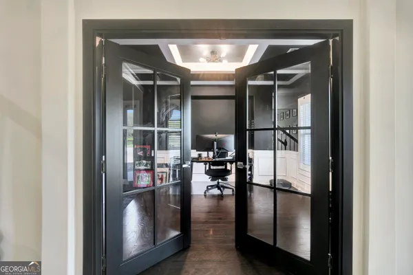 a living room with furniture ceiling fan and a rug