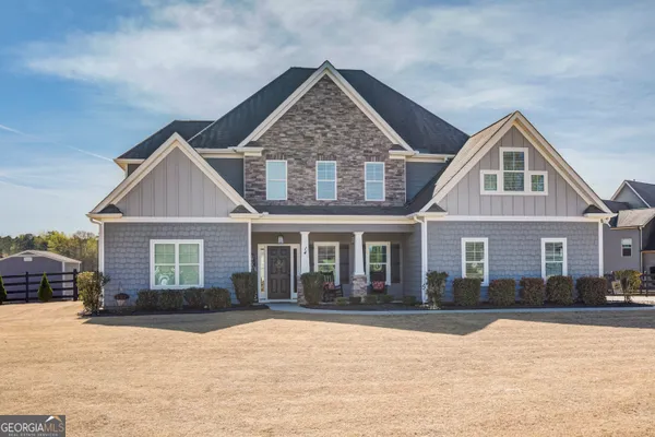 a front view of a house with a yard