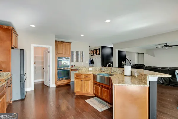a utility room with sink dryer and washer