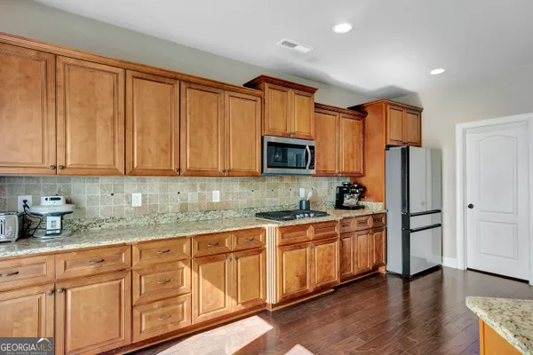 a bed room with a bed and a chair