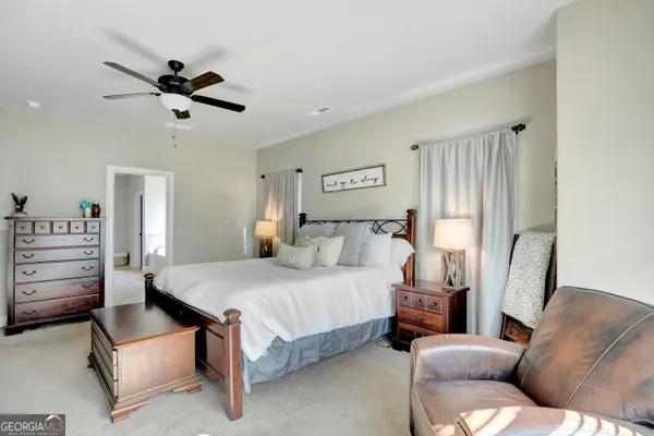 a spacious bathroom with a double vanity sink and a mirror