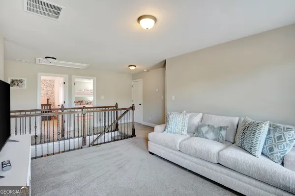 a bathroom with a sink double vanity and a mirror