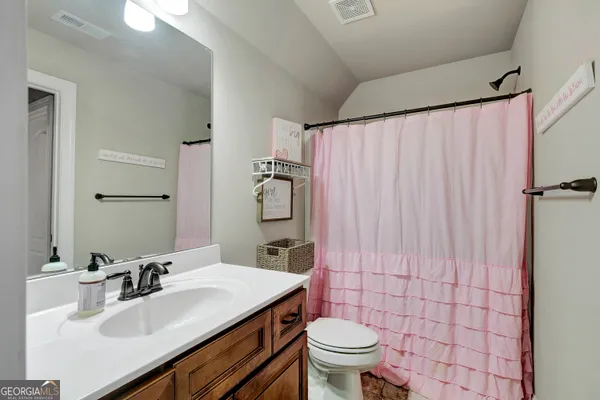 a terrace with outdoor seating and trees