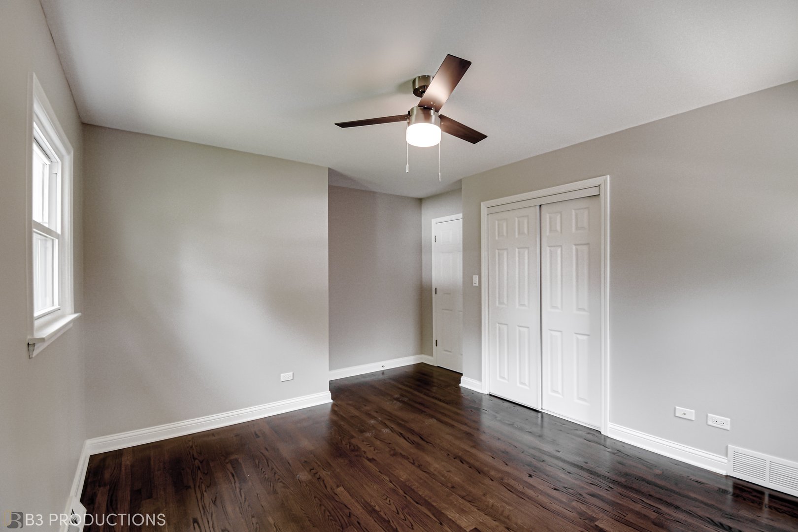 719 Jefferson Street Crete, IL 60417 - Photo 13 of 14 wooden floor in an empty room with a window