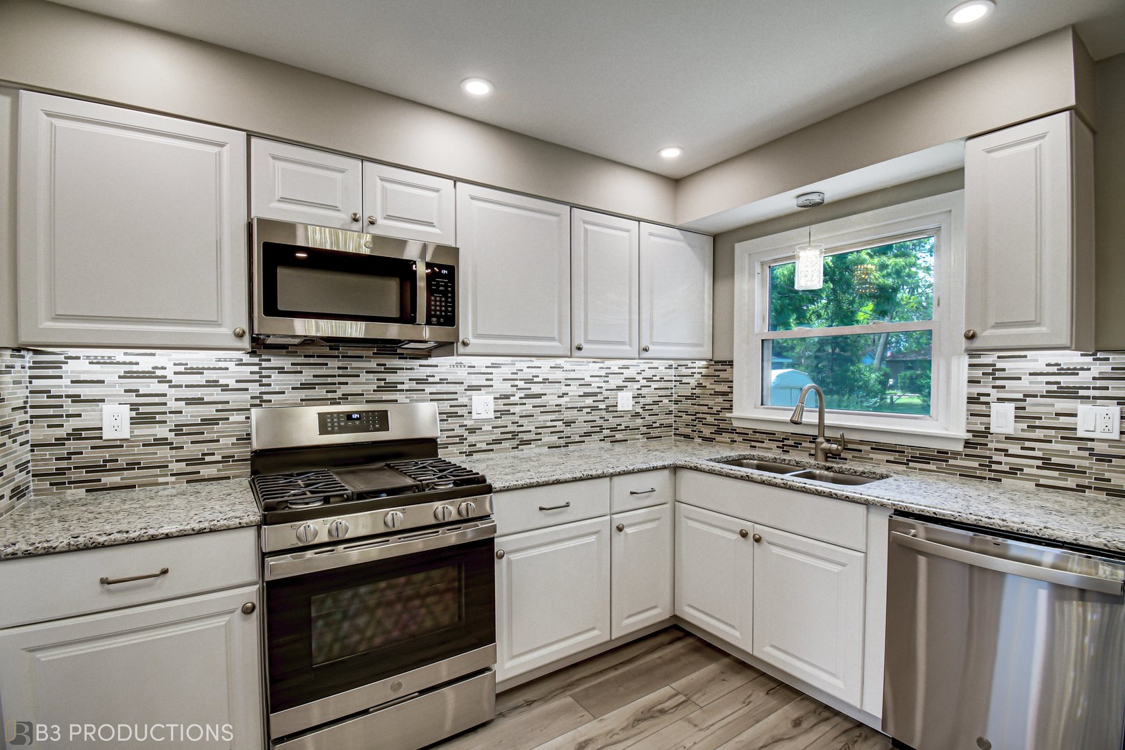 719 Jefferson Street Crete, IL 60417 - Photo 5 of 14 a kitchen with cabinets appliances a sink and a window