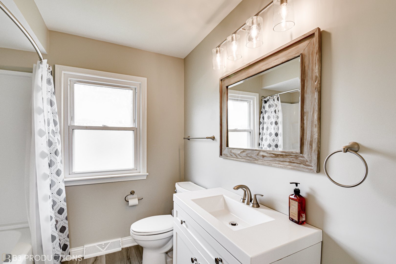 719 Jefferson Street Crete, IL 60417 - Photo 7 of 14 a bathroom with a granite countertop sink toilet a mirror and a window