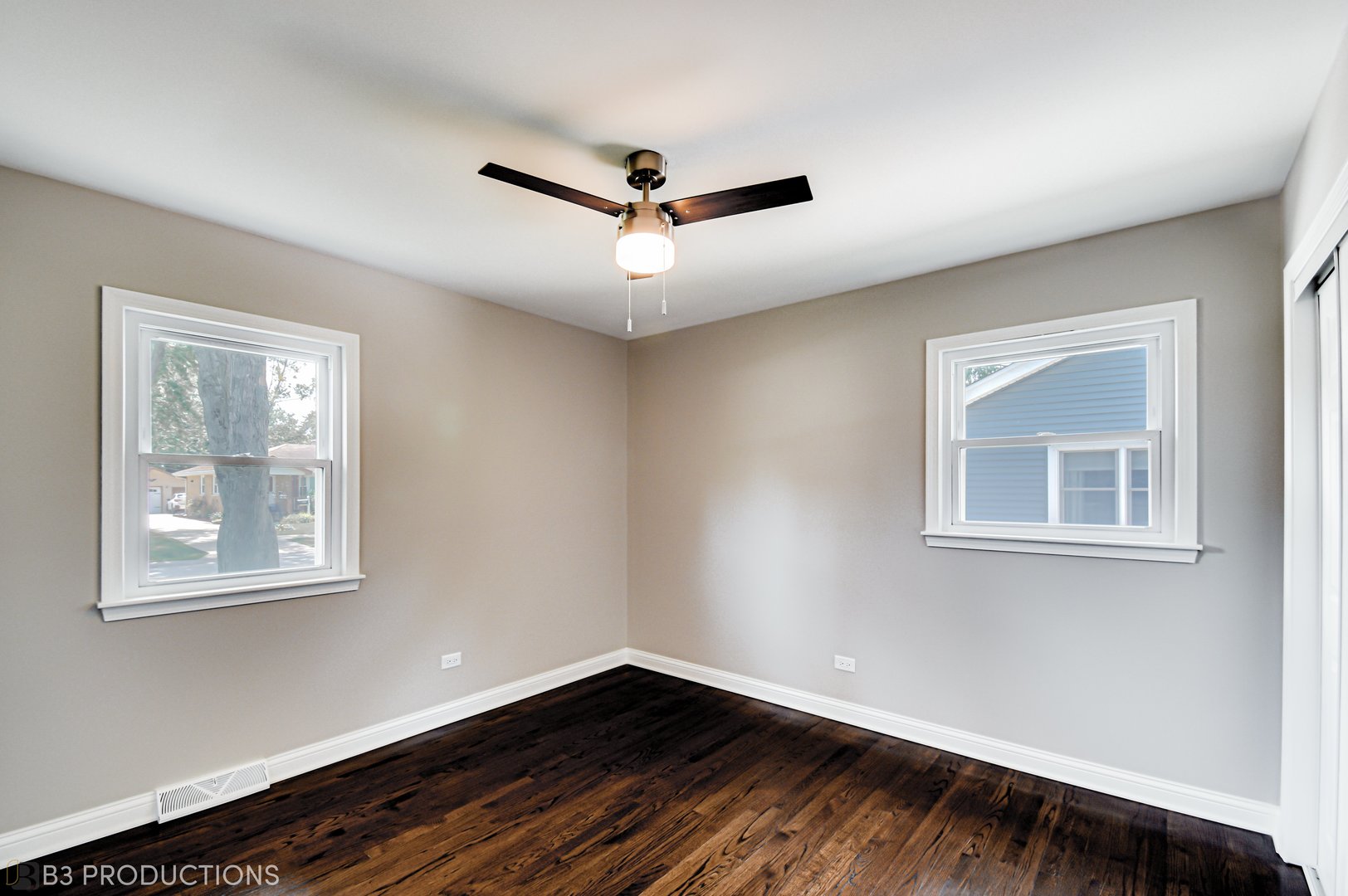 719 Jefferson Street Crete, IL 60417 - Photo 8 of 14 a view of an empty room with a window and wooden floor