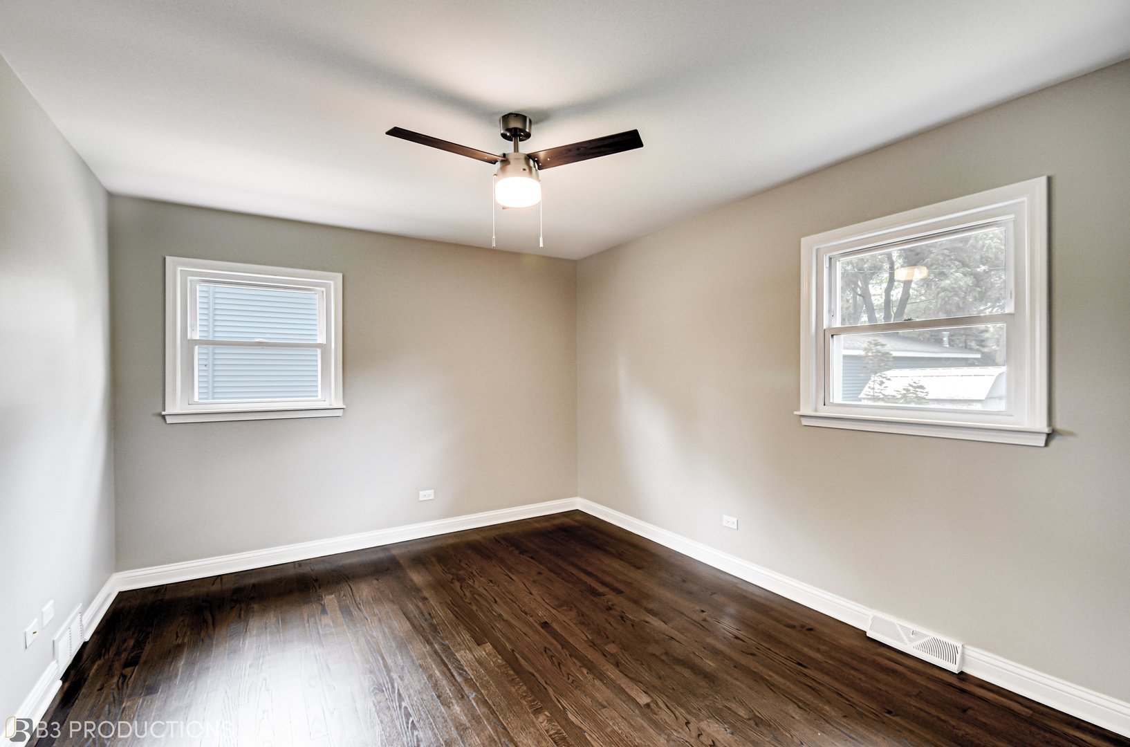 719 Jefferson Street Crete, IL 60417 - Photo 10 of 14 a view of an empty room with wooden floor and a window
