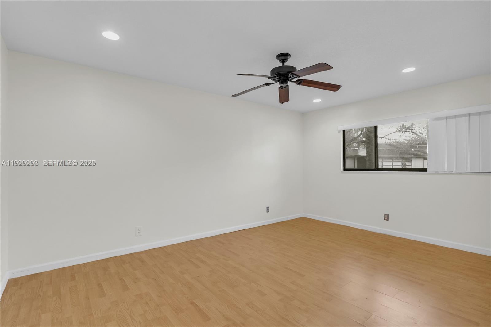 9415 West McNab Road, Unit 204 Tamarac, FL 33321 - Photo 14 of 20 a view of a big room with a ceiling fan and window