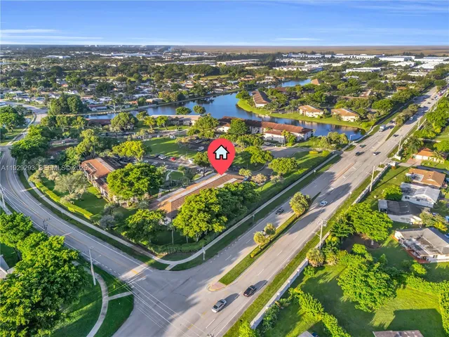 an aerial view of city and swimming pool