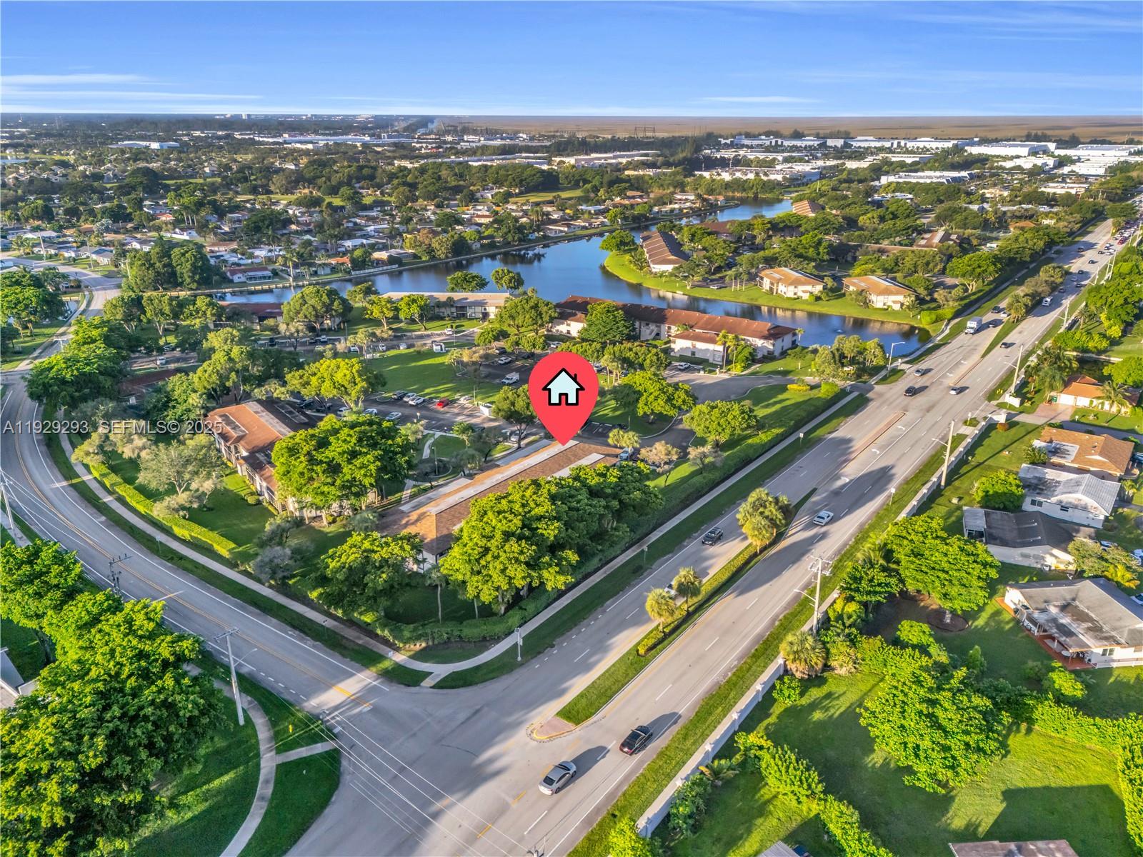 9415 West McNab Road, Unit 204 Tamarac, FL 33321 - Photo 18 of 20 an aerial view of city and swimming pool