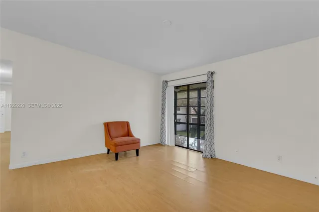 a living room with furniture and gym equipment