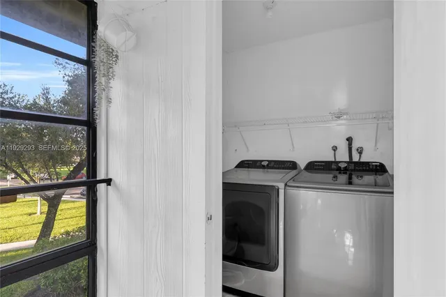 a kitchen with a stove and a window