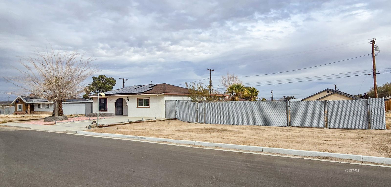 1436 Mayo Street Ridgecrest, CA 93555 - Photo 3 of 29 a view of a house with a snow on the road