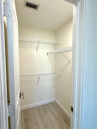 a view of a room with racks on the wall