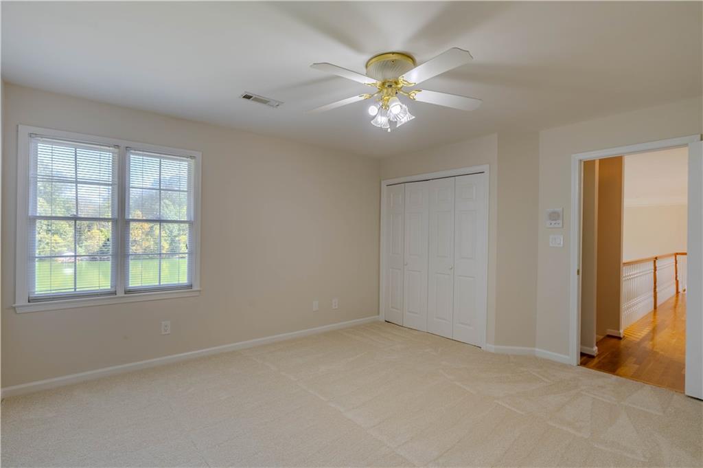 48 Fox Croft Road Rome, GA 30165 - Photo 56 of 69 an empty room with windows and chandelier fan
