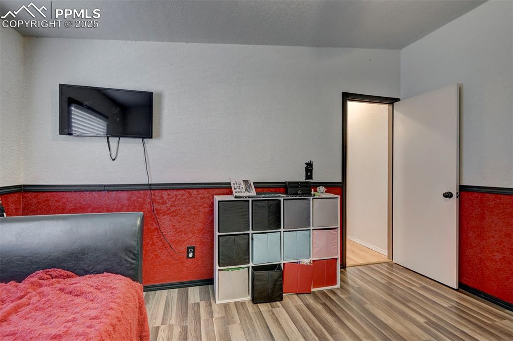 35355 Funk Road Calhan, CO 80808 - Photo 29 of 31 a living room with a bed and a flat screen tv