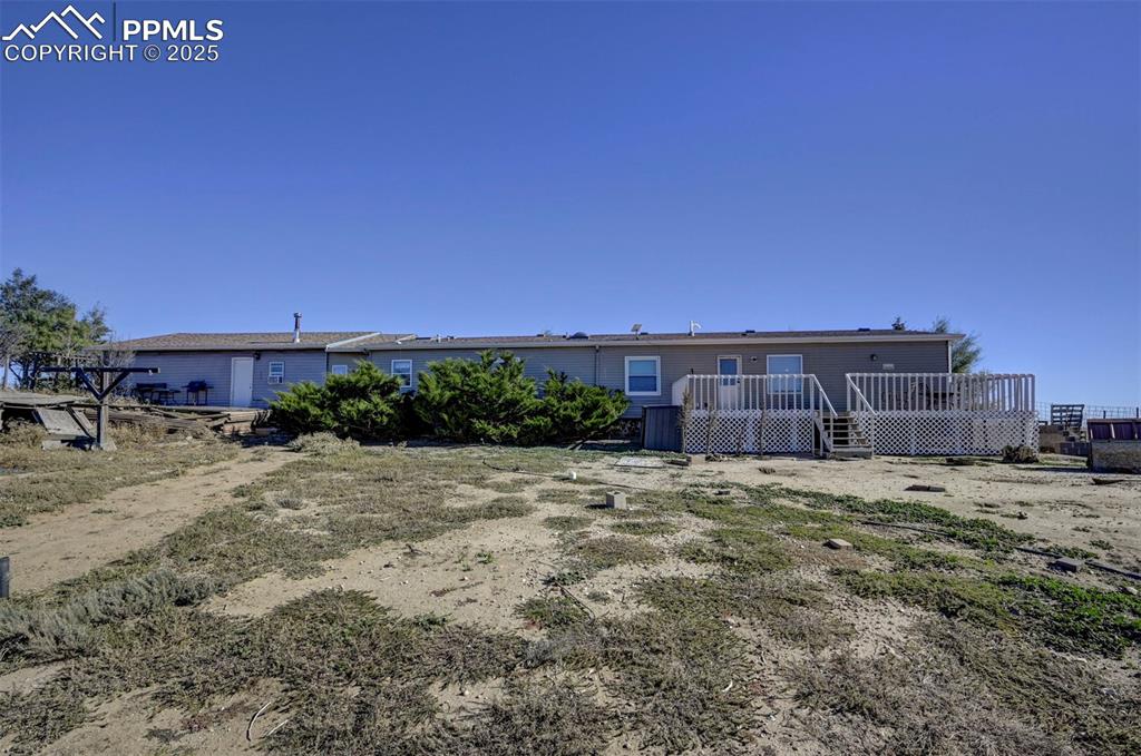 35355 Funk Road Calhan, CO 80808 - Photo 31 of 31 Back of property with a wooden deck