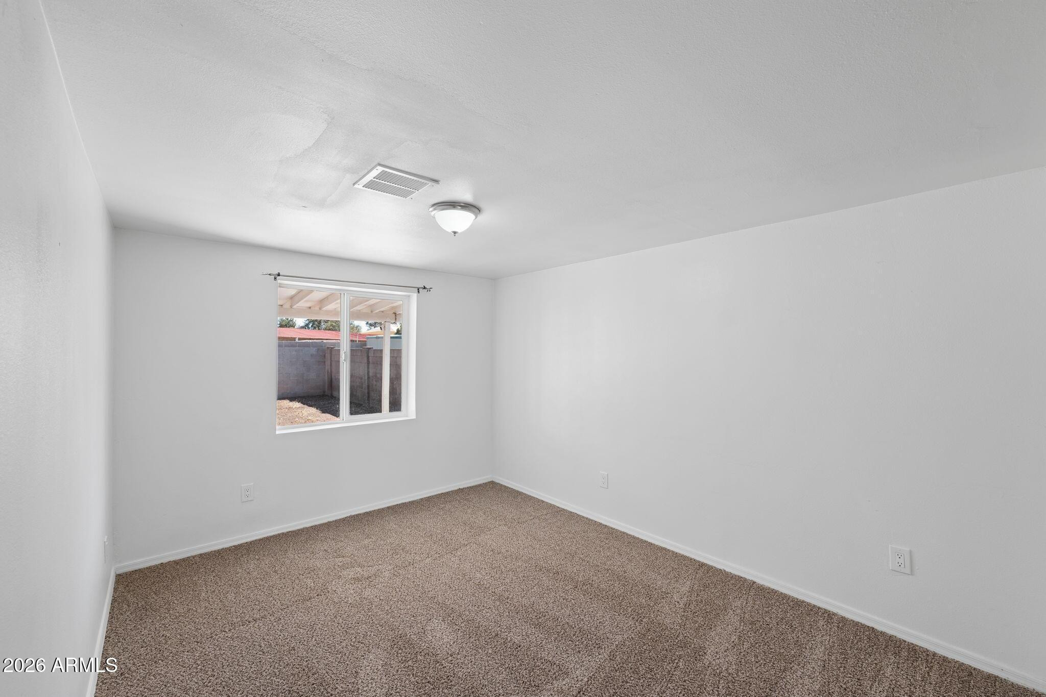 7 South Catalina Street Gilbert, AZ 85233 - Photo 21 of 34 an empty room with a window