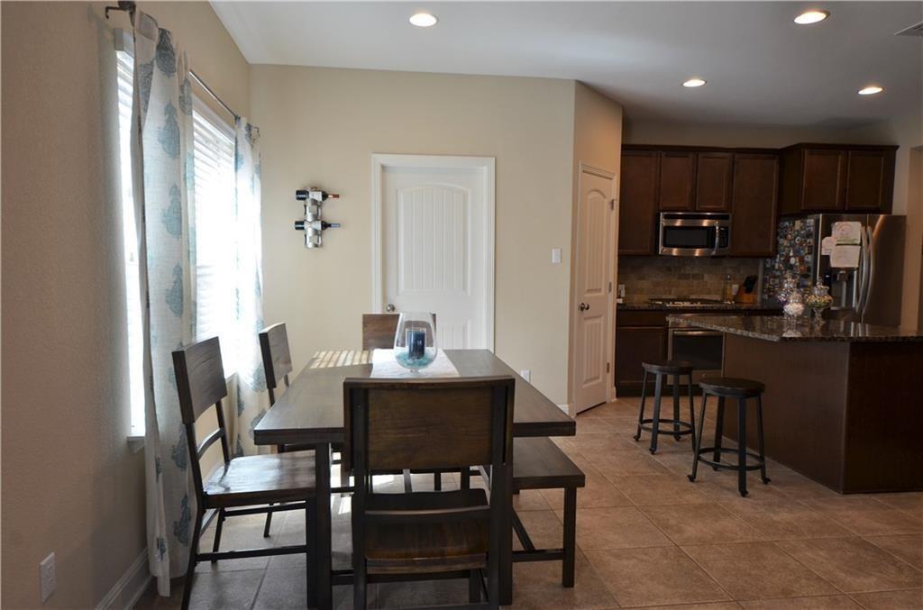 5629 Rio Chama Cove Austin, TX 78738 - Photo 11 of 34 Functional kitchen and dining area with abundant recessed lighting, perfect for everyday living.