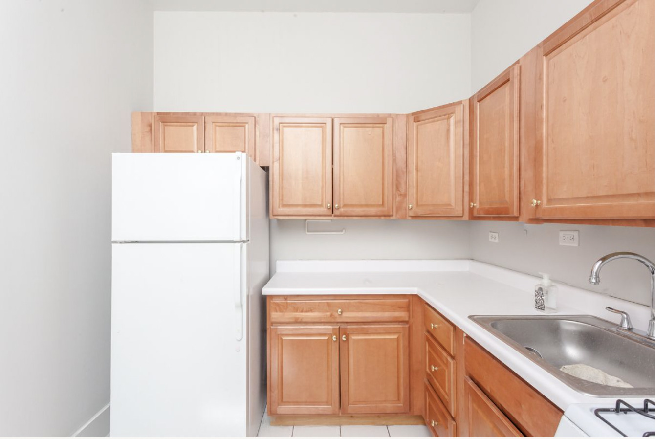 293 East Deerpath Road, Unit 22 Lake Forest, IL 60045 - Photo 11 of 13 a kitchen with a refrigerator sink and cabinets