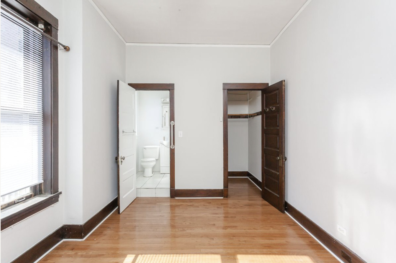 293 East Deerpath Road, Unit 22 Lake Forest, IL 60045 - Photo 3 of 13 a view of an empty room with wooden floor and a window