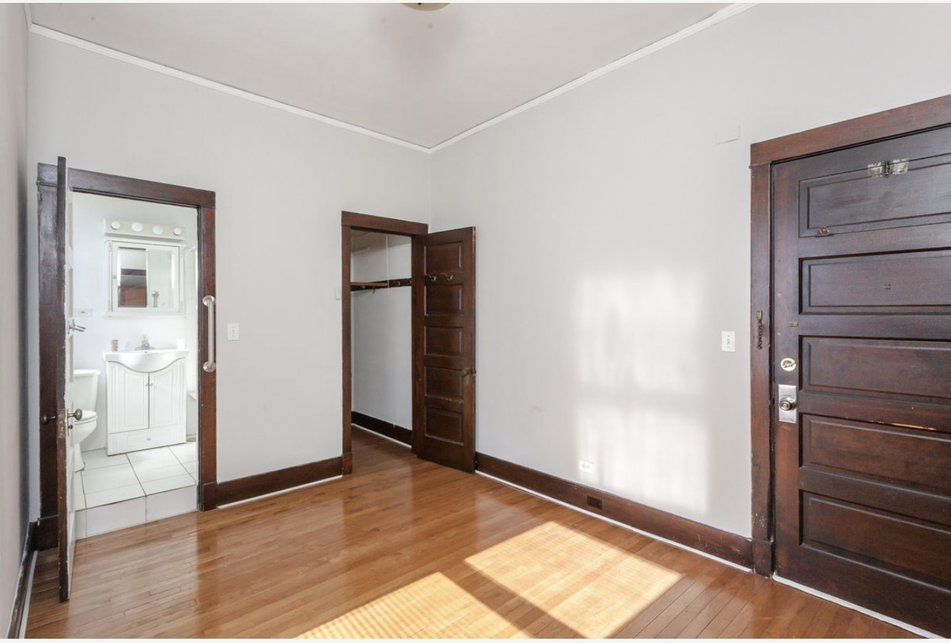 293 East Deerpath Road, Unit 22 Lake Forest, IL 60045 - Photo 6 of 13 a view of an empty room and window with wooden floor