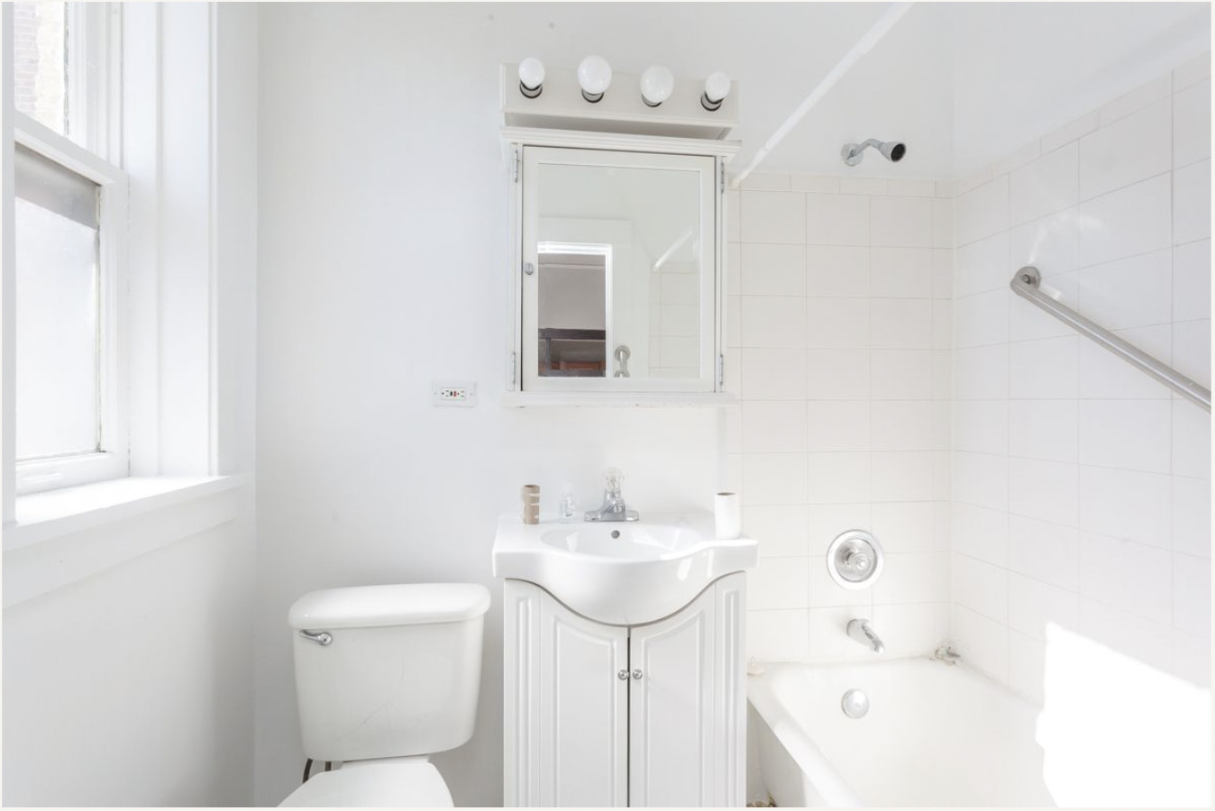 293 East Deerpath Road, Unit 22 Lake Forest, IL 60045 - Photo 7 of 13 a bathroom with a sink a toilet and shower