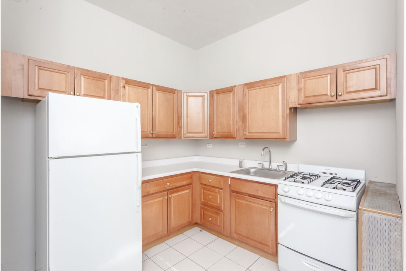 293 East Deerpath Road, Unit 22 Lake Forest, IL 60045 - Photo 9 of 13 a kitchen with a refrigerator sink stove and cabinets